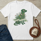 White cotton t-shirt with a green floral dog design and "Bloom Where You Are Rescued" banner.