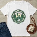 White Rescue Trail Club T-shirt with a green and blue graphic of a hiker, dog, mountains, and trees.