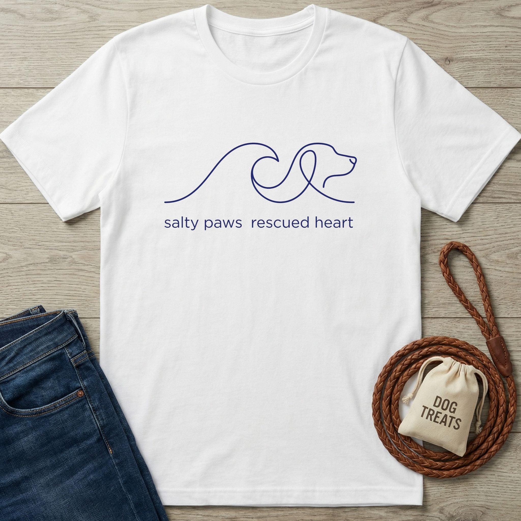 White Gildan Softstyle® 64000 tee with a navy "salty paws rescued heart" dog and wave graphic.