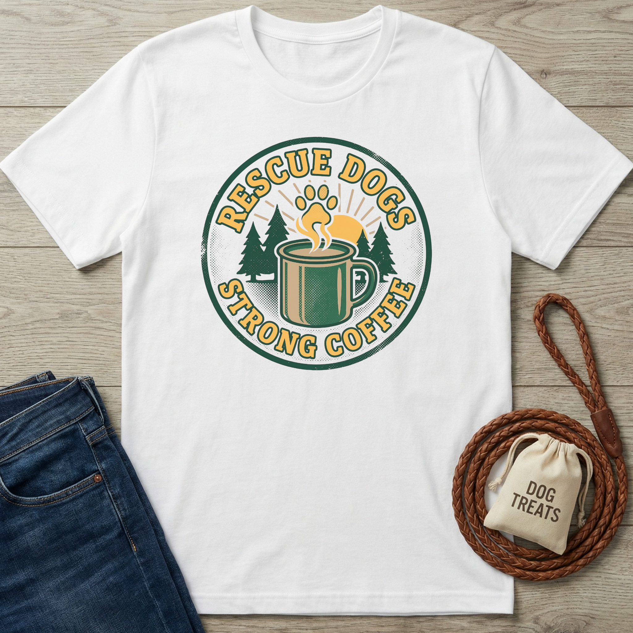 White cotton t-shirt with "Rescue Dogs Strong Coffee" graphic, featuring a paw print, coffee mug, and trees.