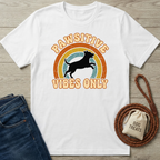 White cotton Pawsitive Vibes Only t-shirt with a jumping dog silhouette over a retro rainbow.