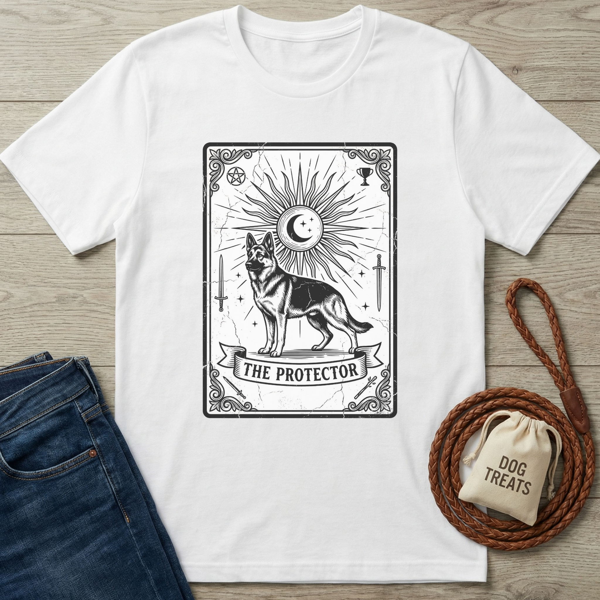 White cotton t-shirt with "The Protector" tarot card design featuring a German Shepherd, sun, and moon.