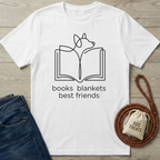 White cotton t-shirt with a black line art design of a dog reading a book, text "books blankets best friends".