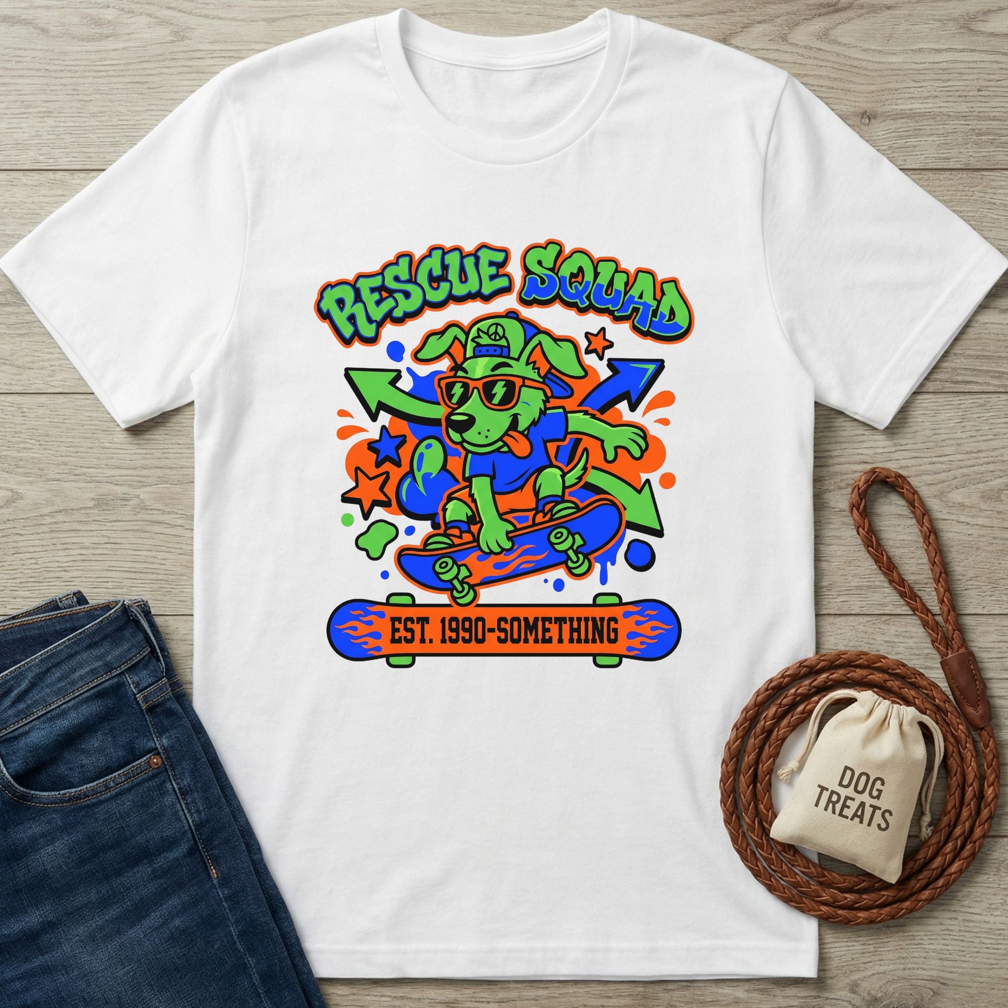 White cotton t-shirt with a vibrant 90s-style graphic of a dog on a skateboard, "Rescue Squad" text.