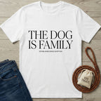 White Gildan Softstyle® 64000 tee with "THE DOG IS FAMILY" text, jeans, leash, and treat bag.
