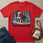 Red crewneck t-shirt featuring a graphic of a husky in a snowy pine forest with the text Winter Wanderer.
